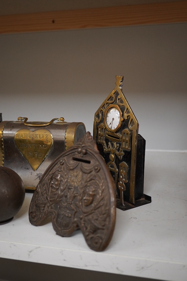 Six various metalware money boxes to include a ‘cannonball’ money box, a ‘safe’ money box, a George V ‘Royal Bank’ money box etc. 19th century and later. Condition - fair